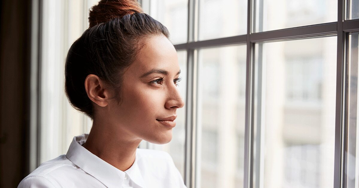 woman thinking about taking a pregnancy test